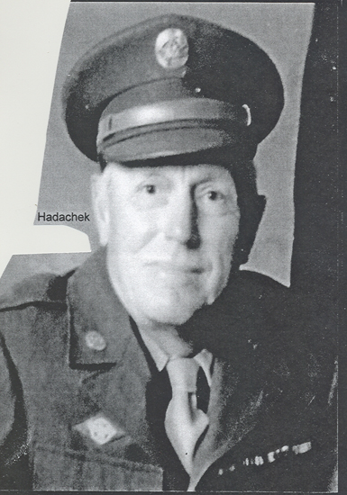 Older veteran Eugene Charles Hadachek wearing a military cap.