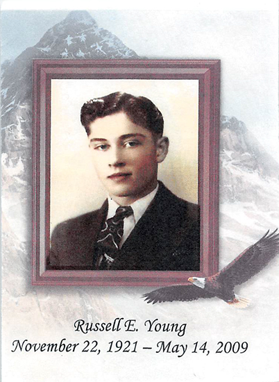 Framed color portrait of Eugene Young Russell wearing a suit and tie.