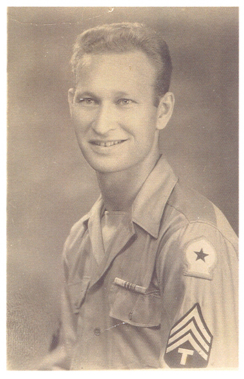 Smiling serviceman shown in a formal sepia portrait.