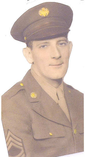 Serviceman wearing a military uniform and garrison cap.