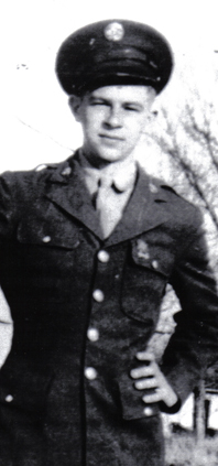 Cropped portrait of a serviceman wearing a decorated military uniform.