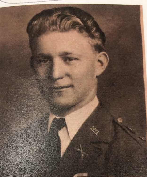 Young man shown in a formal sepia portrait.