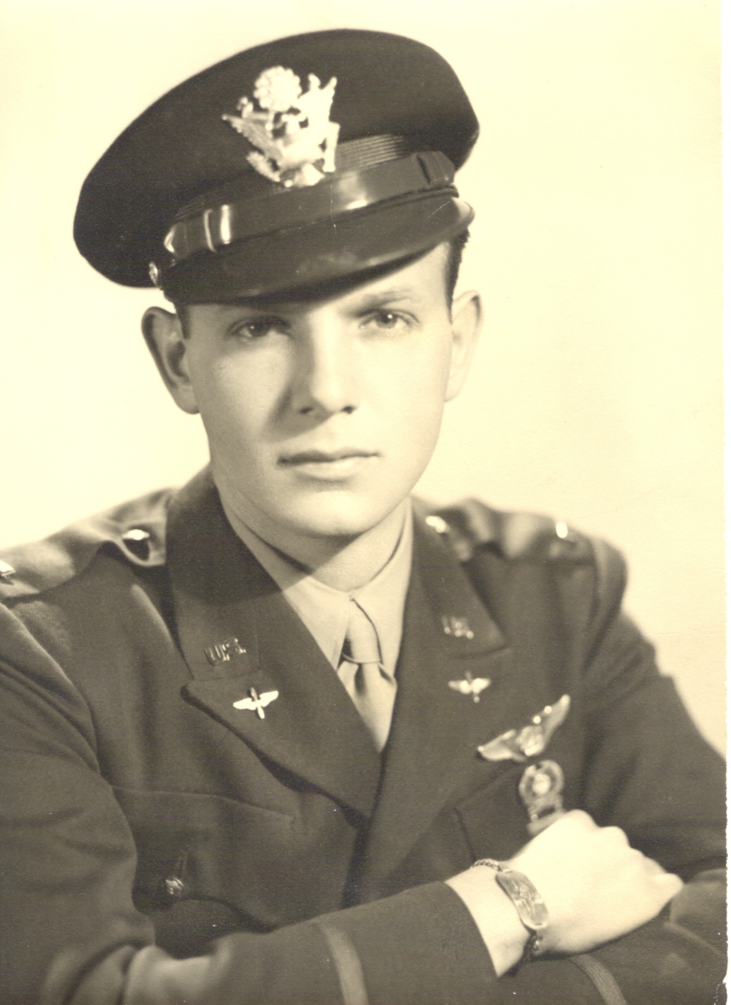 Young serviceman wearing a military uniform and peaked cap in 1945.