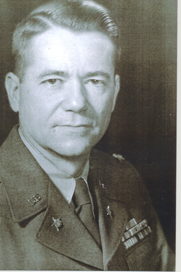 Older man shown in a formal black-and-white portrait.