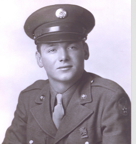 Young serviceman wearing a military uniform and peaked cap.