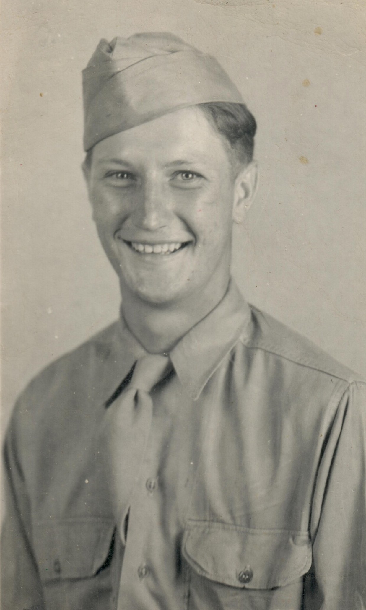 Smiling James Nagely shown in a close-up military portrait.