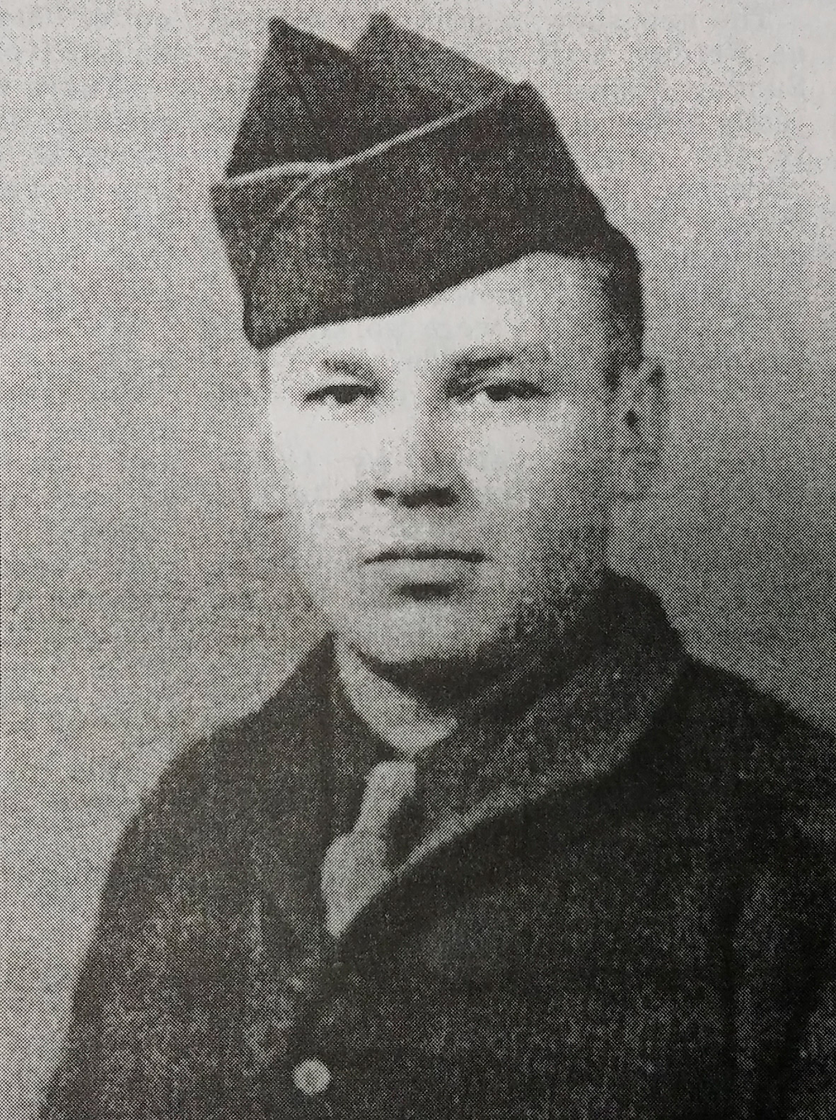 World War II veteran Jim Sharp wearing a military garrison cap.