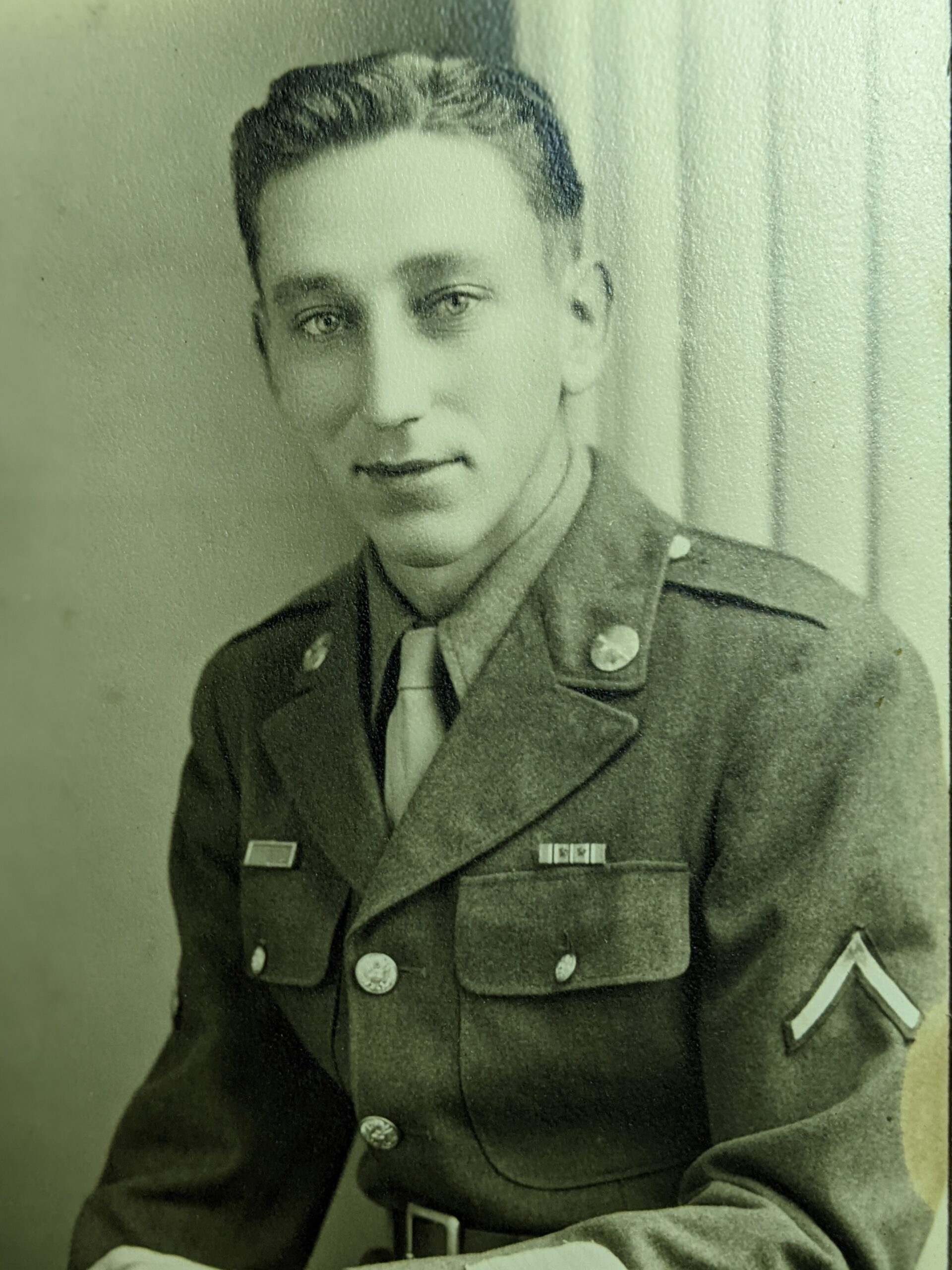 Joe Kasl wearing a U.S. Army uniform in a formal portrait.
