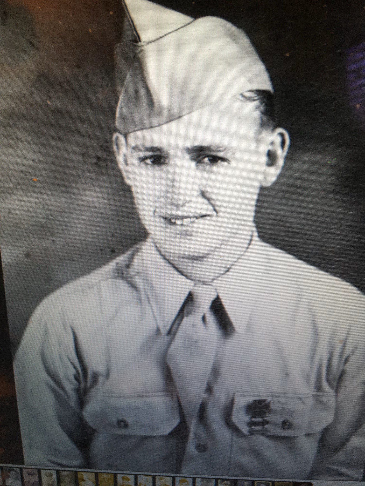 John Dockery wearing a military uniform and garrison cap.