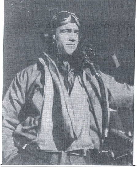 Robert Keel wearing military flight gear and an aviator cap.