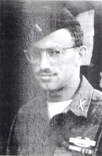 Edward Kenney wearing glasses in a black-and-white portrait.