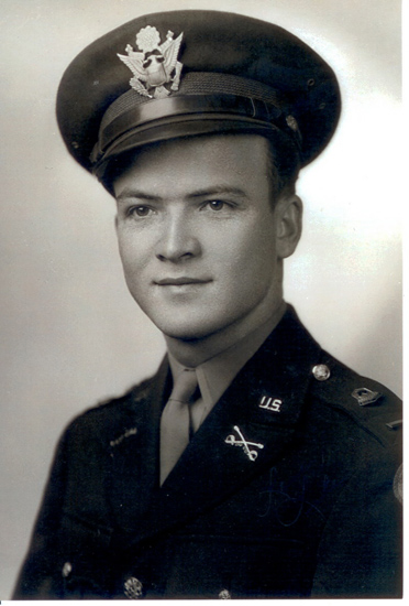 Serviceman wearing a U.S. Army uniform and peaked cap.