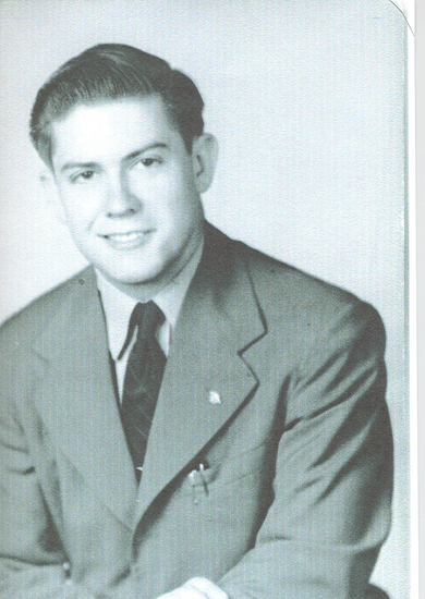 Lawrence Everett shown in a formal portrait wearing a suit and tie.