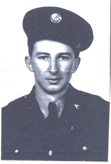 Lawrence Riedy wearing a dark U.S. Navy uniform and cap.