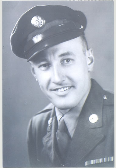 Young serviceman wearing a military uniform and peaked cap.
