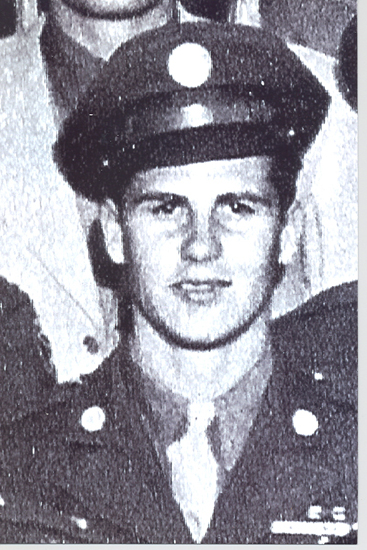 Errett Louis Lujan wearing a military cap in a grainy portrait.