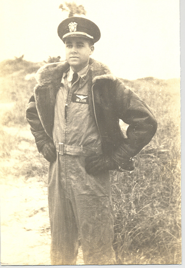 Karl Ray Marrs standing outdoors in military flight gear.