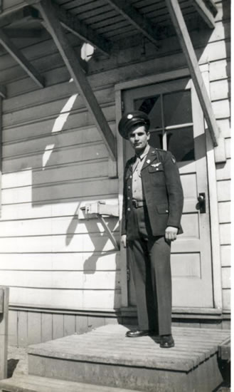 Marvin P. Geist standing outside a building in military uniform.