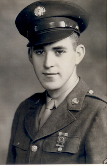 Serviceman wearing a military uniform and garrison cap.