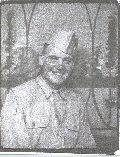 Smiling Elvin Leroy Monroe wearing a military uniform and garrison cap.
