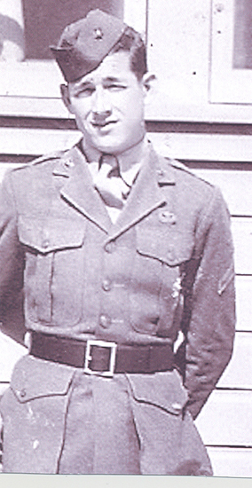 Cropped portrait of a serviceman wearing a military dress uniform.