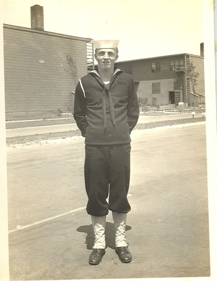 Myron Dean Phillips standing outdoors in a U.S. Navy uniform.