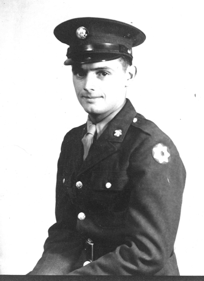 : LaVerne Nuss wearing a military police uniform and peaked cap.