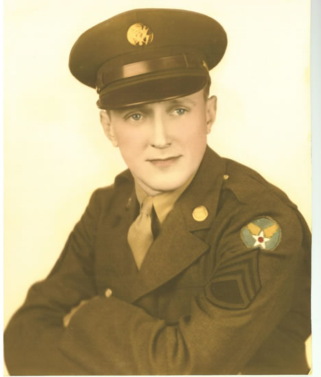 Young serviceman wearing a decorated U.S. Army uniform and peaked cap.