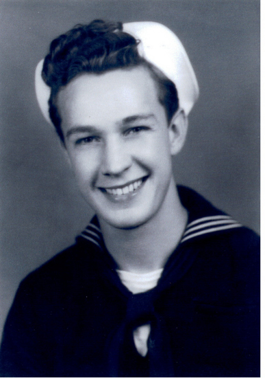 Smiling Orla Lee Phelps wearing a naval uniform and white cap.