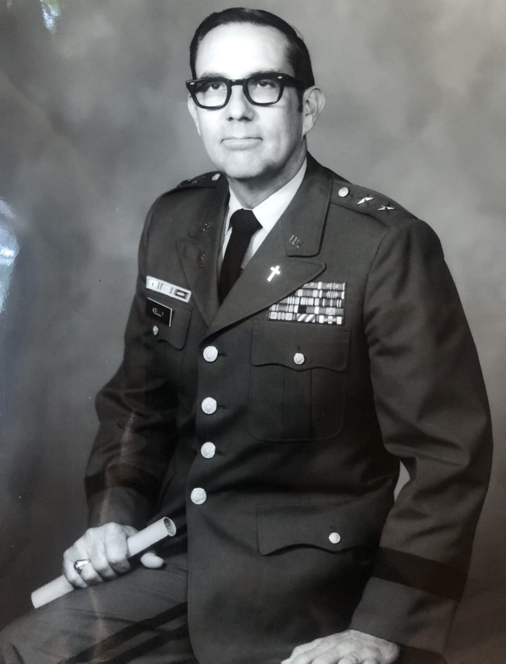 Orris Kelly wearing glasses and a decorated U.S. Army uniform.