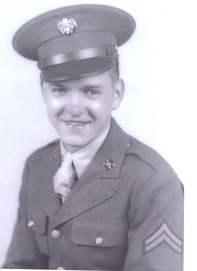 Smiling Paul B. Poelhuis wearing a military uniform and peaked cap.