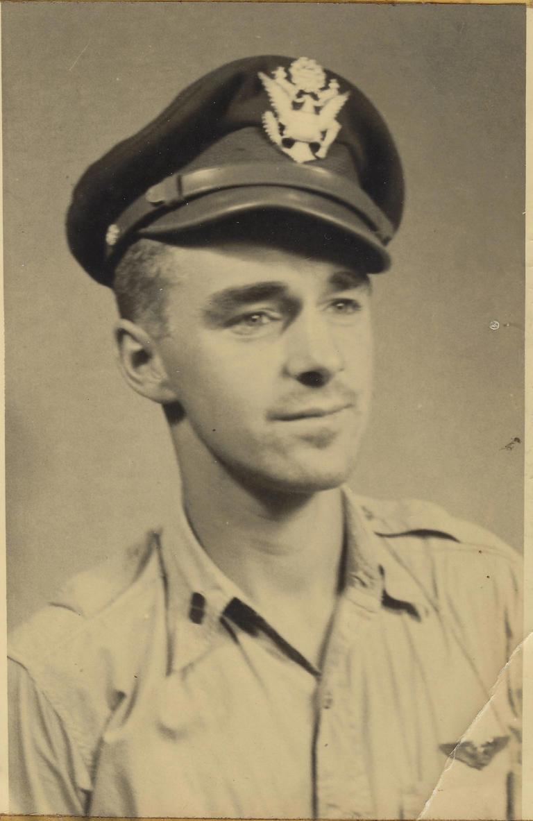 Roger Smith wearing a military dress uniform and cap.