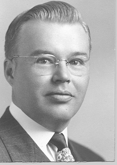 Robert Wesley Gilger wearing glasses in a formal portrait.