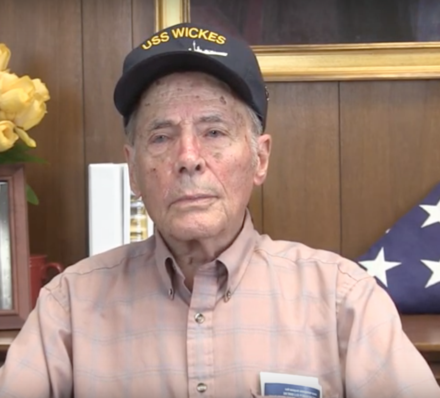 Older veteran wearing a military ship cap in a color portrait.