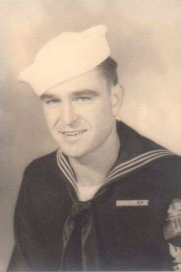 Young serviceman wearing a U.S. Army uniform and peaked cap.