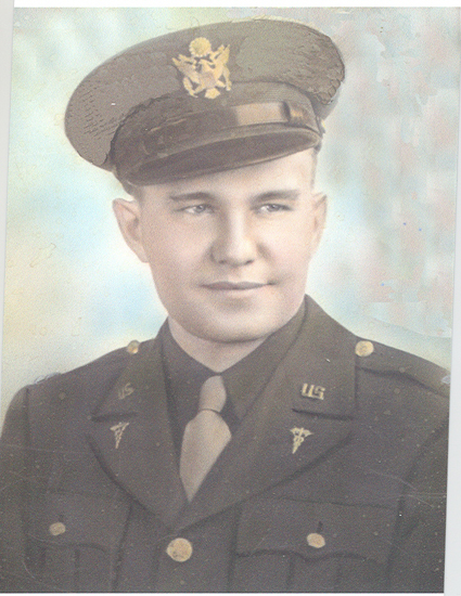 Serviceman wearing glasses and a military uniform in a formal portrait.
