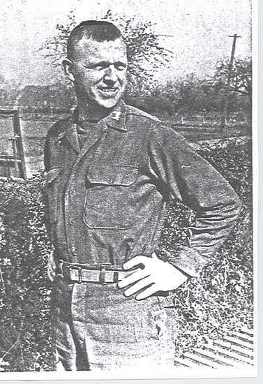 Robert W. Stewart standing outdoors in military clothing.