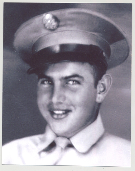 Henry Carl Stieben smiles for his portrait in his military uniform.