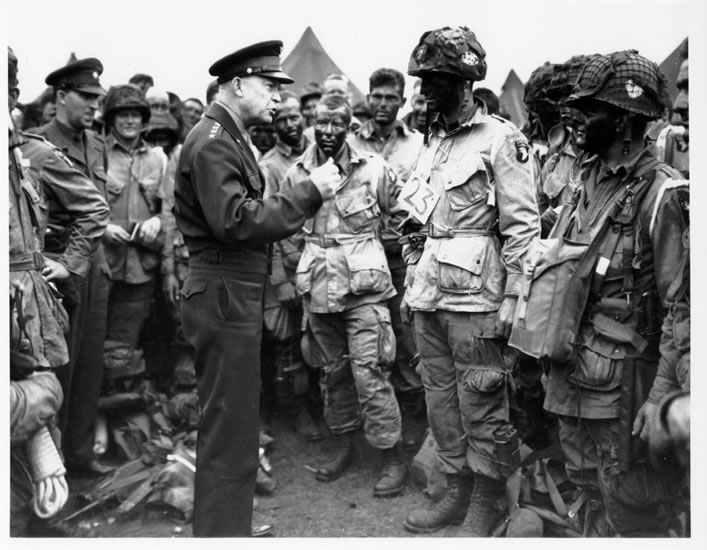 General Dwight D. Eisenhower speaking with paratroopers before the D-Day invasion.