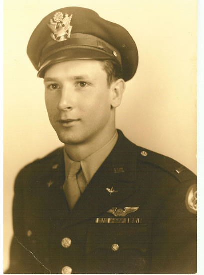 Young serviceman wearing a U.S. Army uniform and peaked cap.