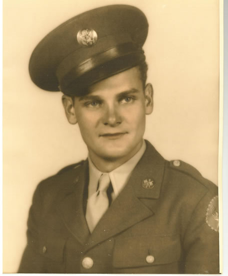 Young serviceman wearing a U.S. Army uniform and peaked cap.