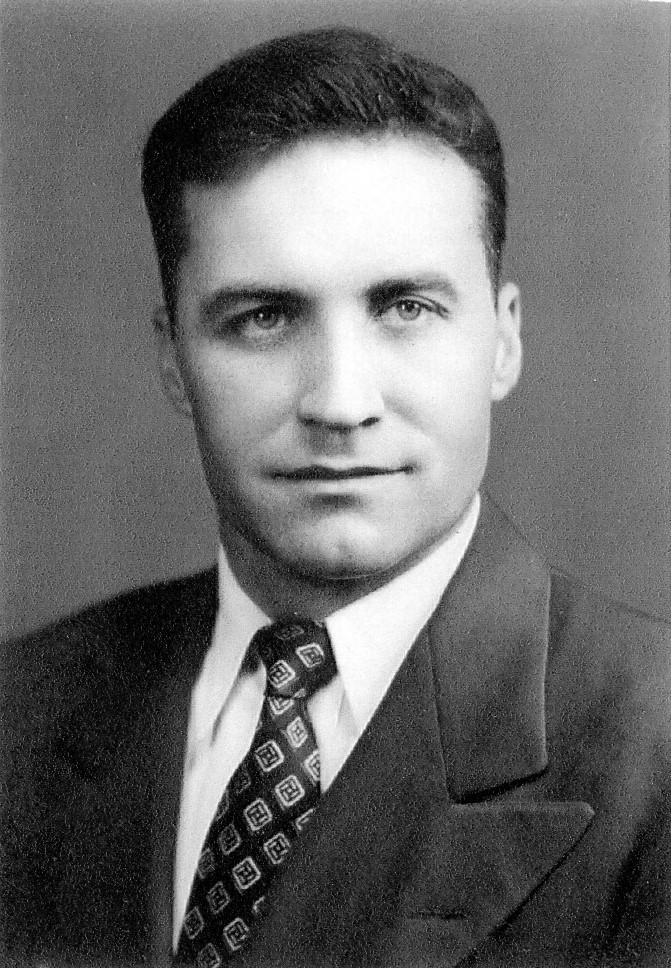 Tom Rothwell shown in a formal black-and-white portrait.