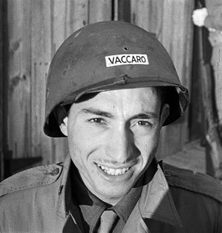 Tony Vaccaro wearing a military helmet labeled “Vaccaro.”
