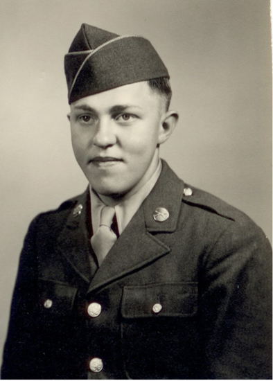 Young serviceman wearing a U.S. Army uniform and garrison cap.