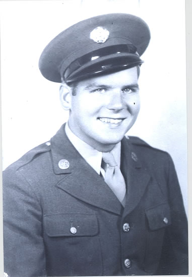 Smiling serviceman wearing a U.S. Army uniform.