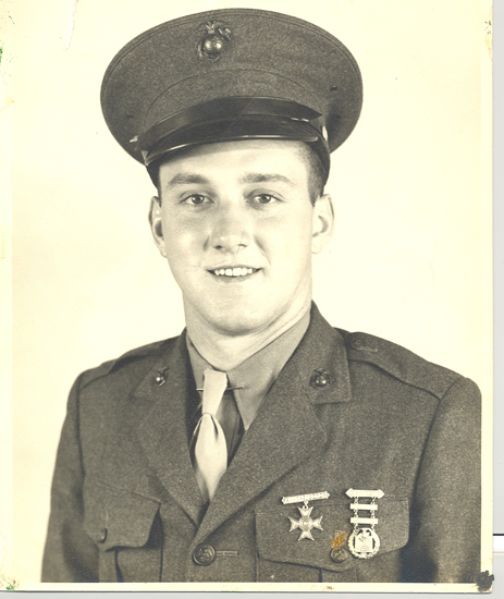 Virgil Shockey smiling in a U.S. Army uniform and peaked cap.