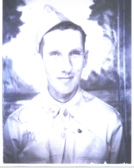 Young serviceman wearing a military uniform in a formal portrait.