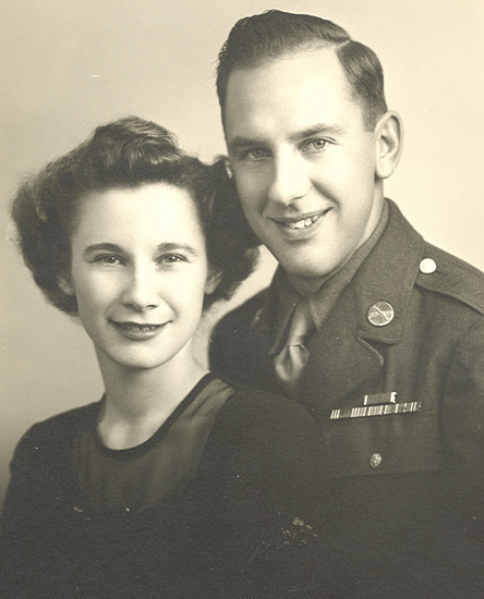 Walter Reusch posing with a woman while wearing a U.S. Army uniform.