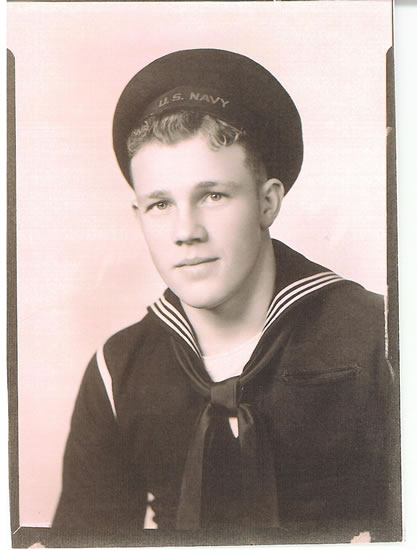 Young sailor wearing a U.S. Navy uniform and cap.