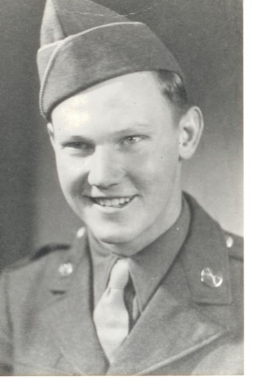 Young man smiling in a formal military portrait.